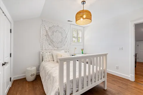 a balcony view with a couple of chairs and a potted plant