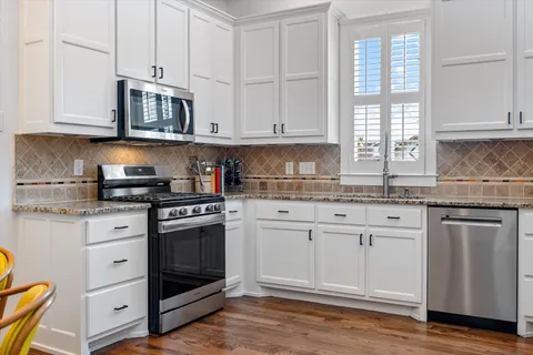 a view of a house with a yard and plants