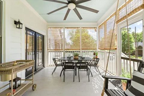 a living room with furniture a window and a fireplace