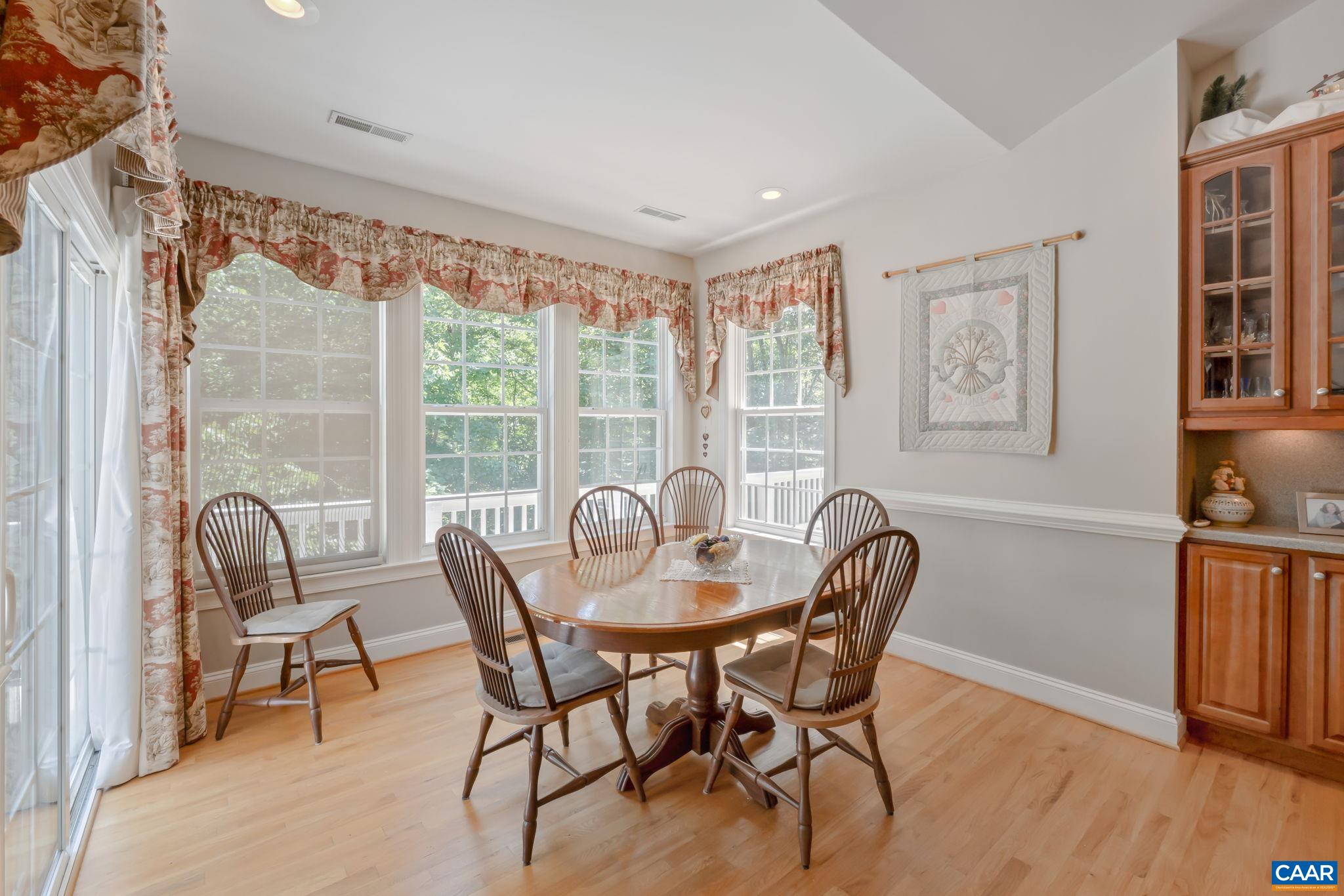 27 Kingswood Road Palmyra, VA 22963 - Photo 12 of 60 a dining room with furniture a chandelier and wooden floor
