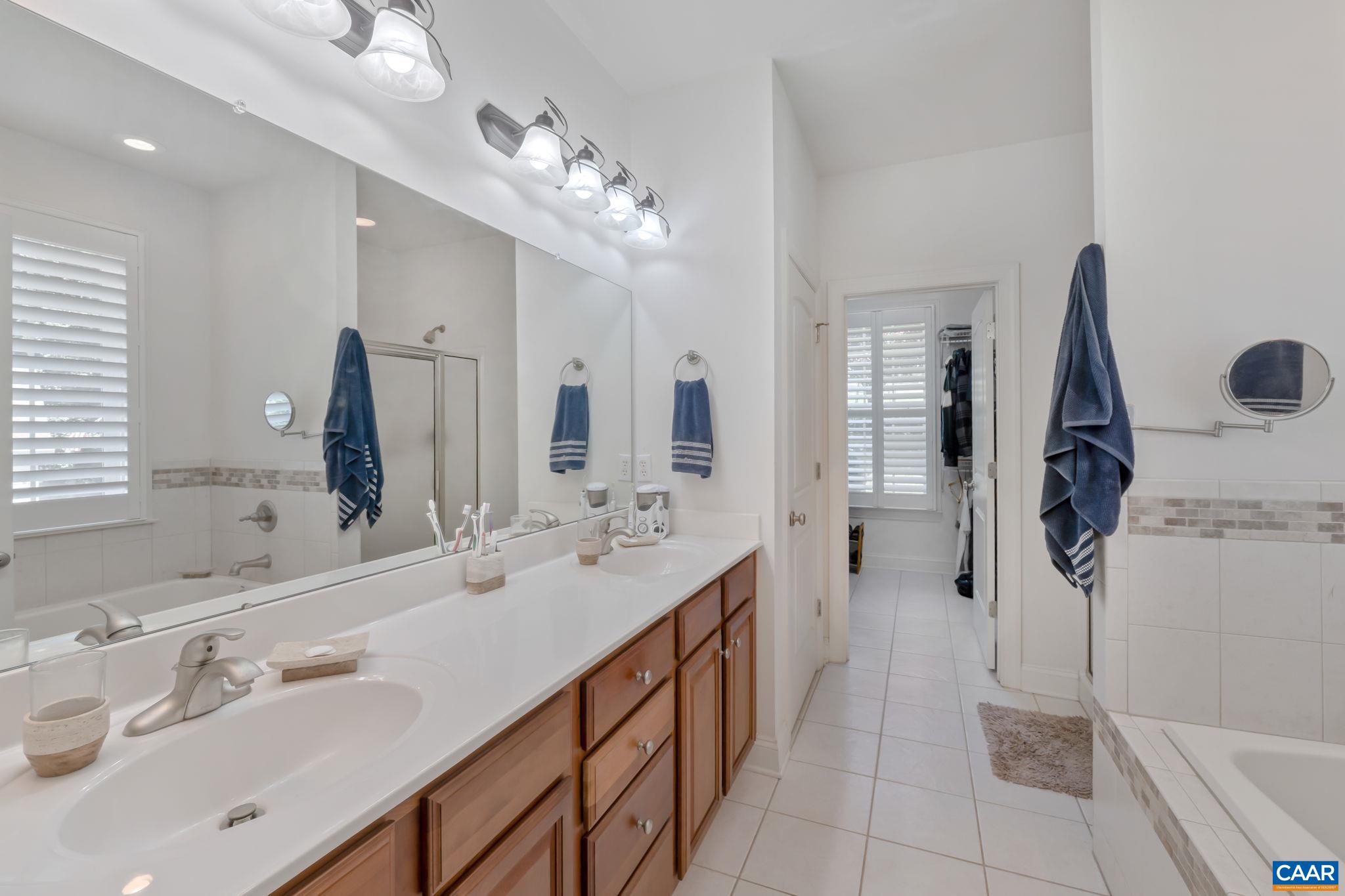 27 Kingswood Road Palmyra, VA 22963 - Photo 18 of 60 a spacious bathroom with a double vanity sink a mirror and shower