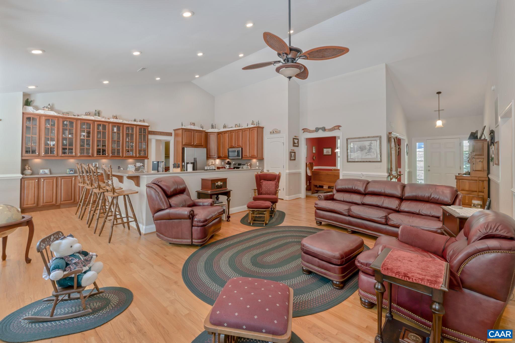 27 Kingswood Road Palmyra, VA 22963 - Photo 3 of 60 a living room with furniture kitchen view and a wooden floor