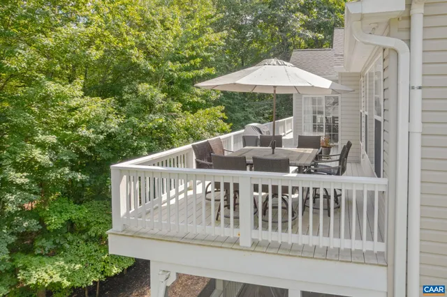 an aerial view of a house with swimming pool patio and outdoor seating