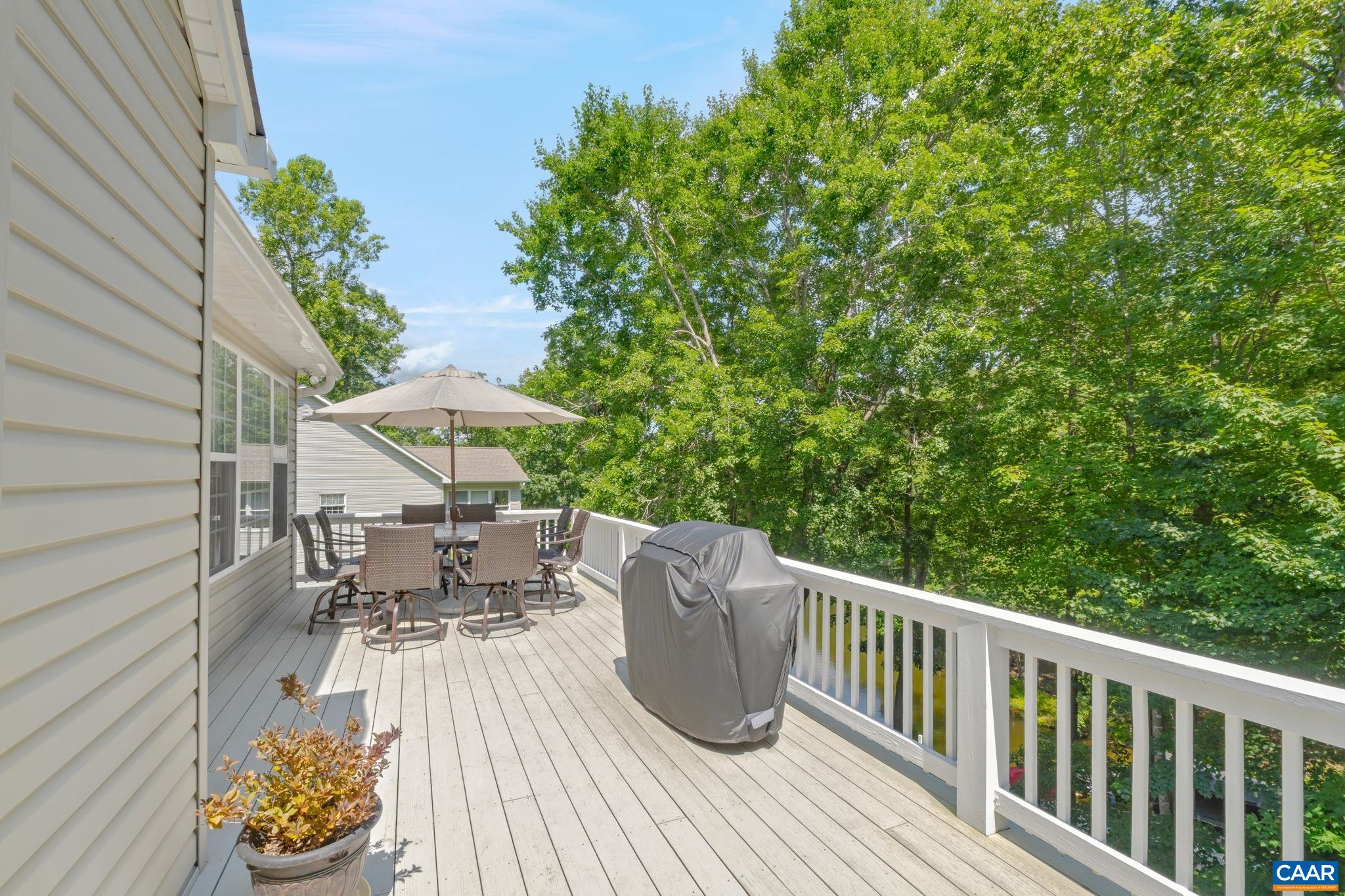27 Kingswood Road Palmyra, VA 22963 - Photo 35 of 60 a view of balcony with furniture and potted plants