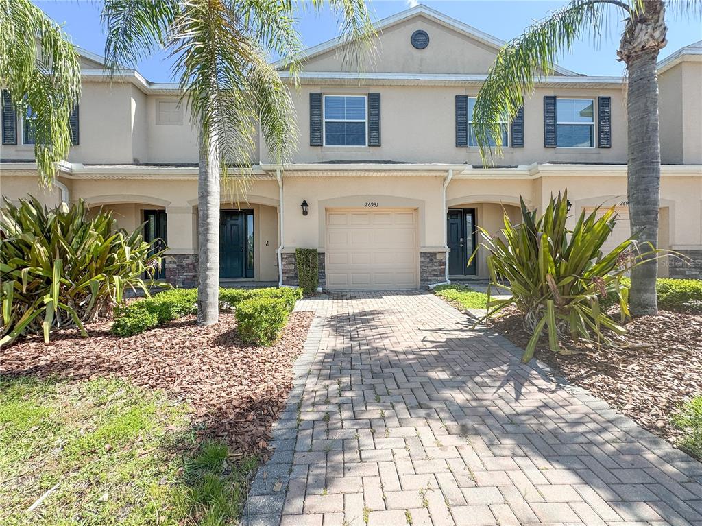 a front view of a house with garden