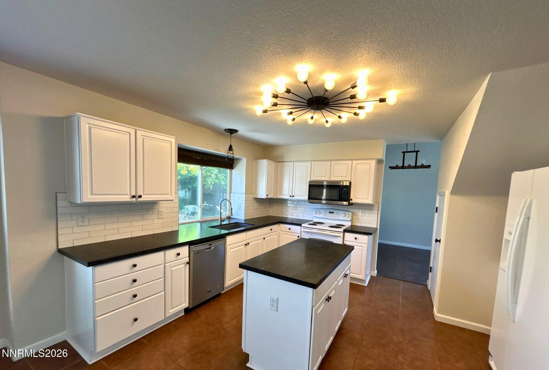 4437 Highplains Drive Reno, NV 89523 - Photo 6 of 19 a kitchen with a sink stove and refrigerator
