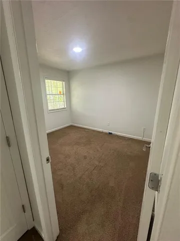 a view of a kitchen with wooden floor