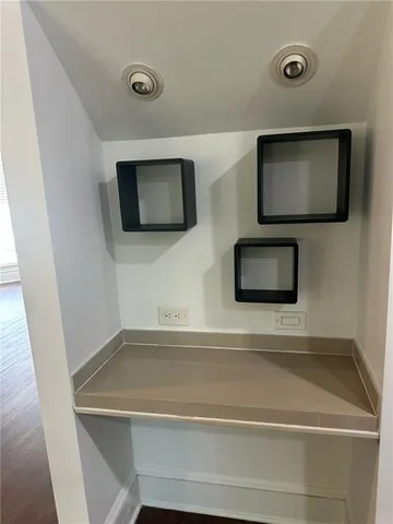 a kitchen with stainless steel appliances granite countertop a sink and a refrigerator