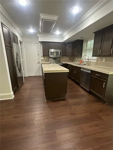 a bathroom with a toilet a sink and a window