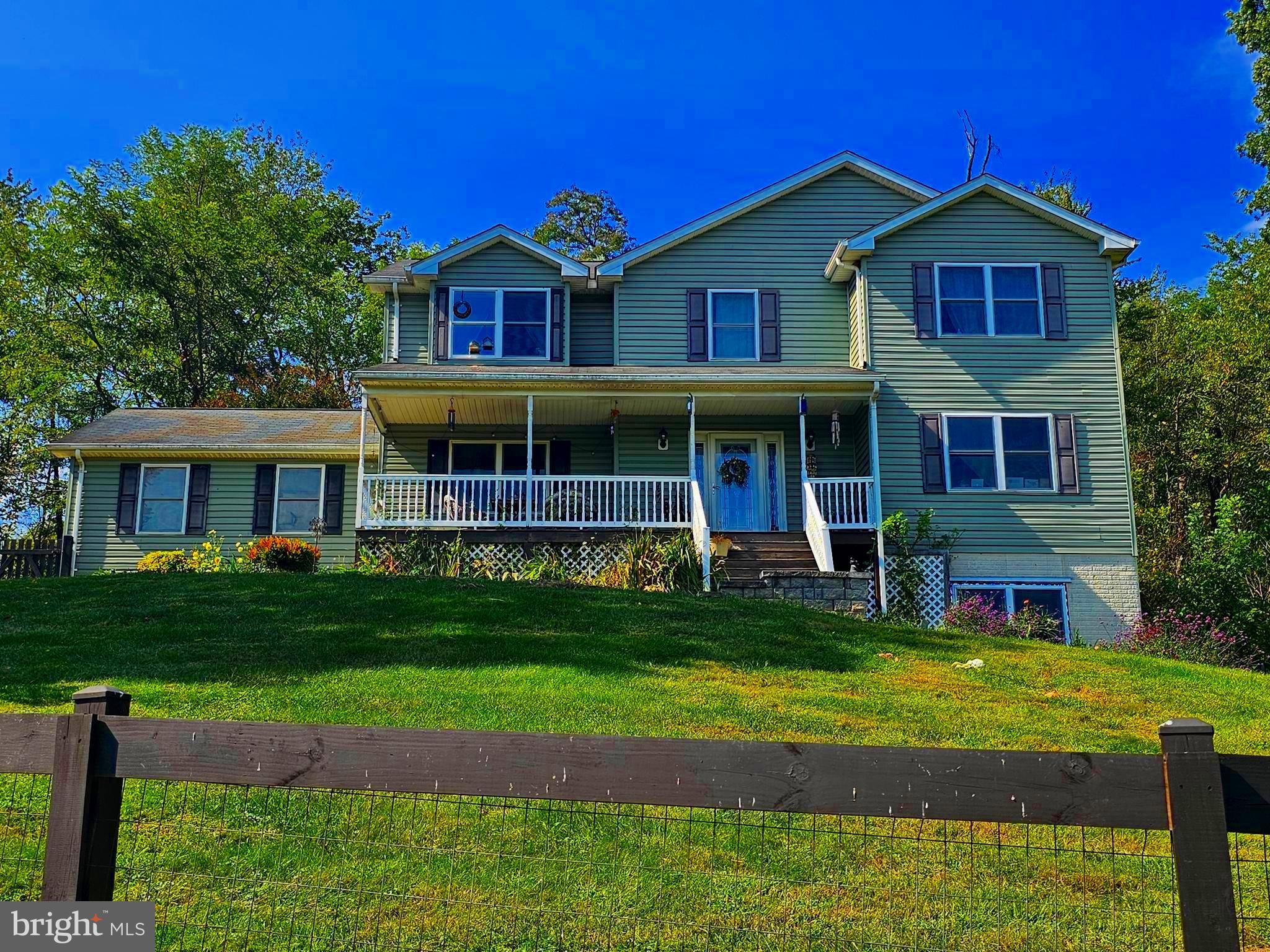 a front view of a house with a yard table and chairs