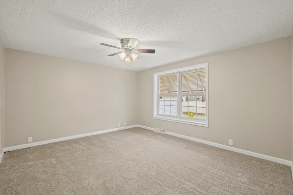 an empty room with a empty space and a window