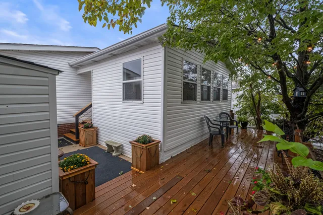 a view of a chairs and table in the balcony