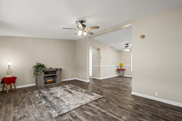 a very nice looking room with a ceiling fan