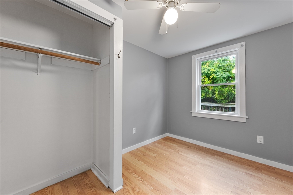 25 Durham Street Lawrence, MA 01843 - Photo 11 of 34 a view of a room with a window and a ceiling fan