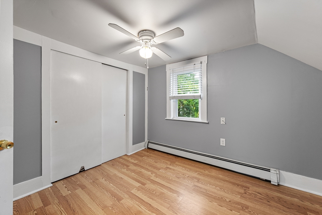 25 Durham Street Lawrence, MA 01843 - Photo 16 of 34 a view of an empty room with wooden floor and a window