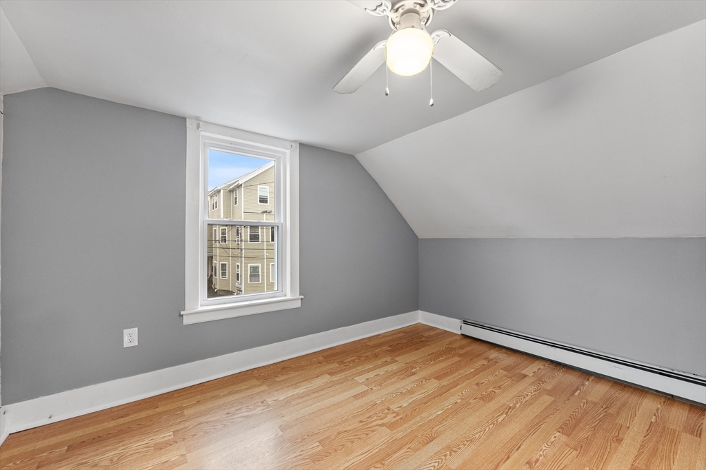 25 Durham Street Lawrence, MA 01843 - Photo 18 of 34 wooden floor in an empty room with a window