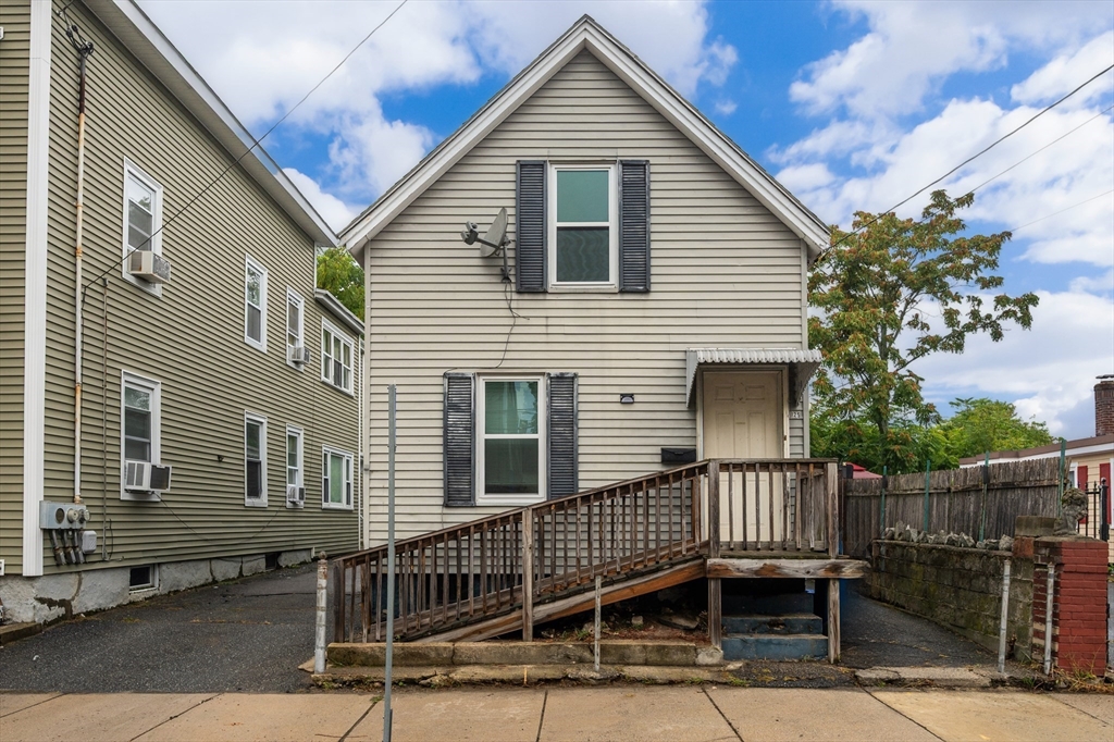 25 Durham Street Lawrence, MA 01843 - Photo 20 of 34 a view of a house with a wooden deck