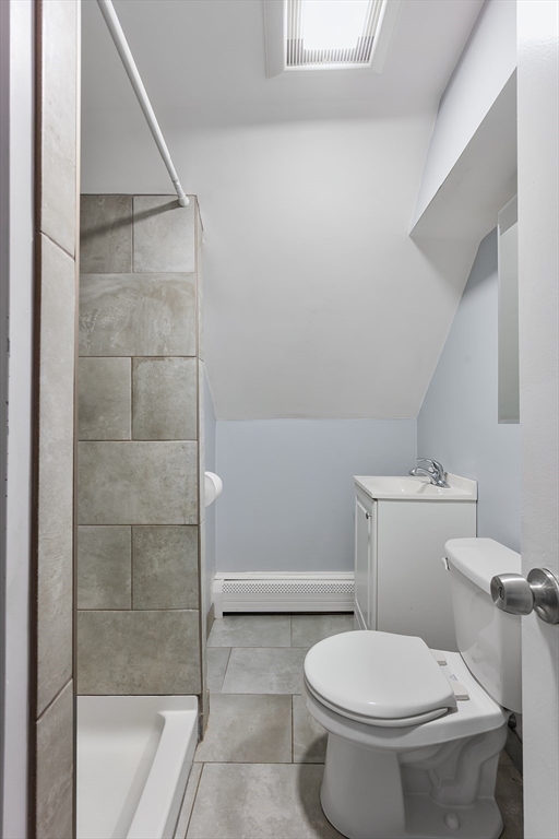 25 Durham Street Lawrence, MA 01843 - Photo 21 of 34 a white toilet sitting next to a bath tub