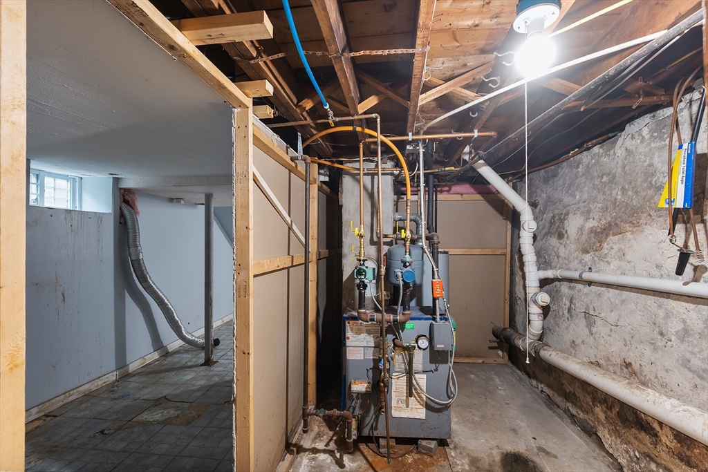 25 Durham Street Lawrence, MA 01843 - Photo 24 of 34 a view of walk in closet with clothes and shoes