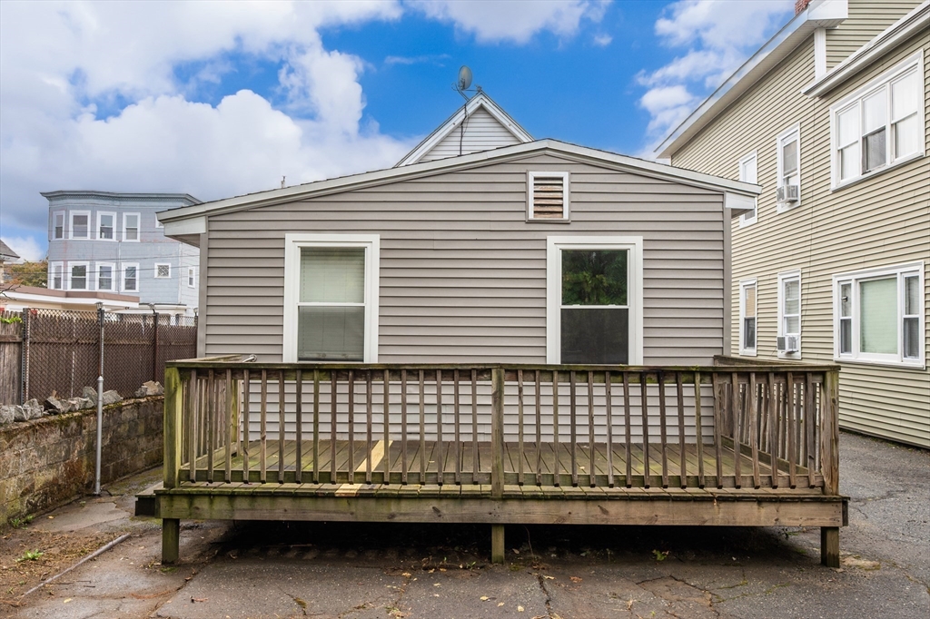 25 Durham Street Lawrence, MA 01843 - Photo 27 of 34 a view of a house with a small wooden deck