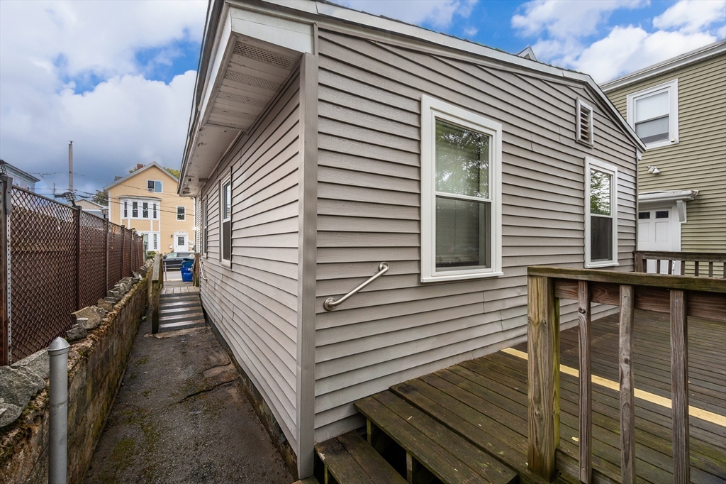 25 Durham Street Lawrence, MA 01843 - Photo 29 of 34 a view of a house with a deck and wooden floor