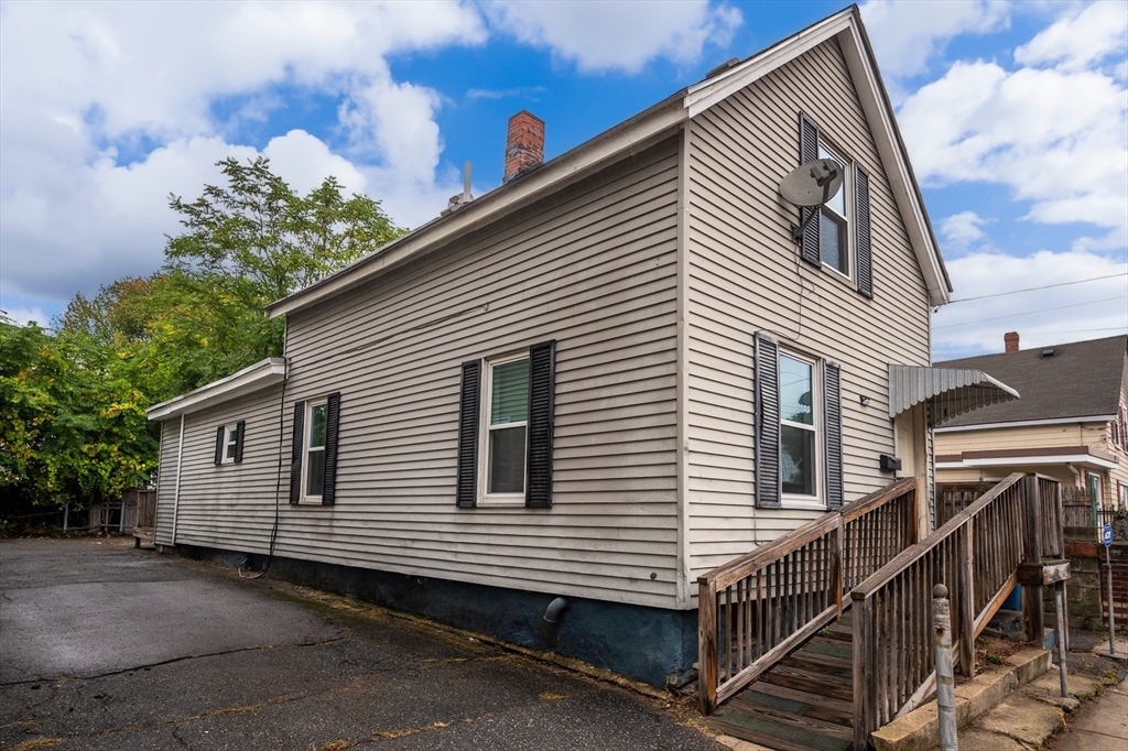 25 Durham Street Lawrence, MA 01843 - Photo 33 of 34 a view of a house with a yard