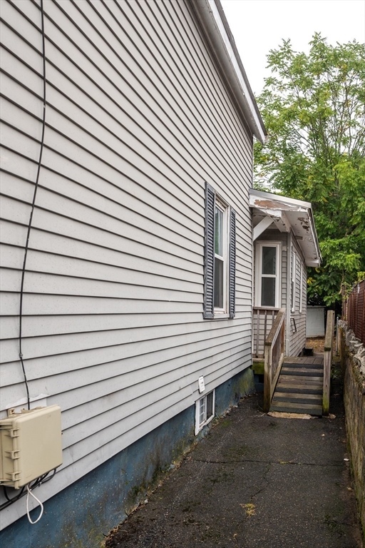 25 Durham Street Lawrence, MA 01843 - Photo 34 of 34 a view of a house with a yard and a large window