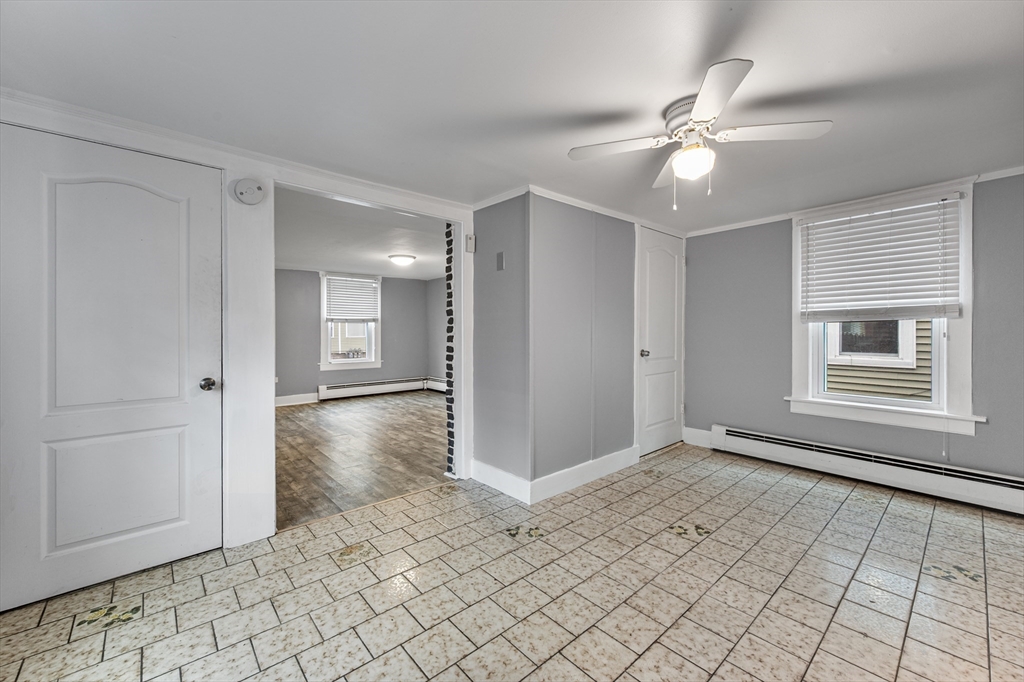 25 Durham Street Lawrence, MA 01843 - Photo 5 of 34 a view of a livingroom with a chandelier fan and windows