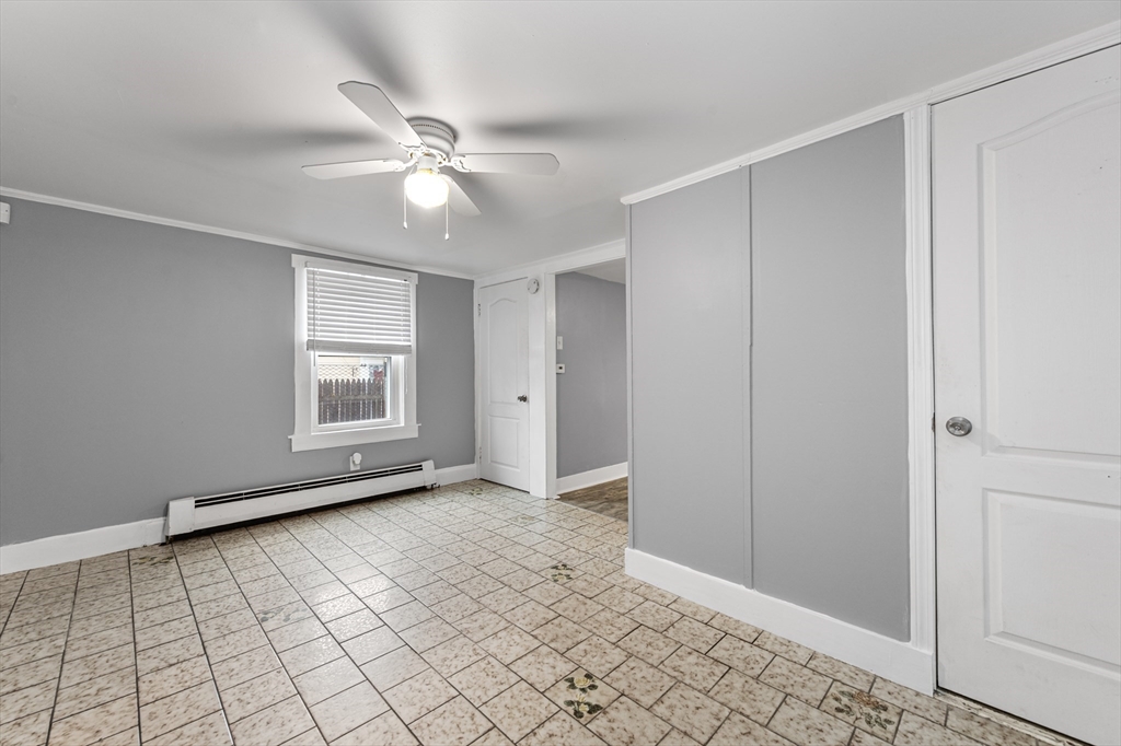 25 Durham Street Lawrence, MA 01843 - Photo 7 of 34 a view of an empty room with window and chandelier fan