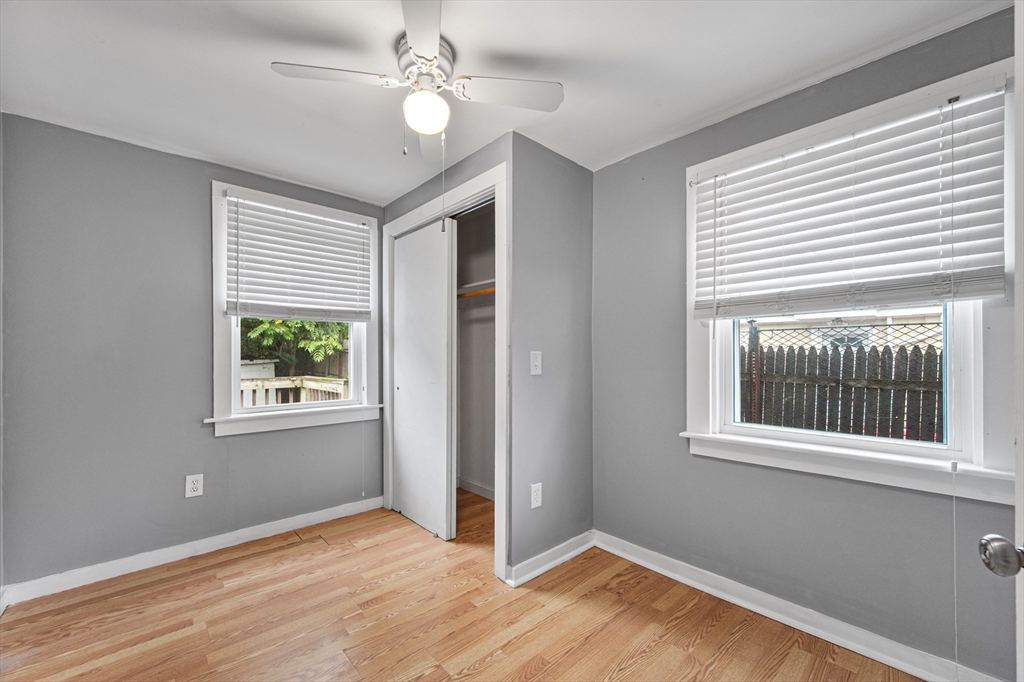 25 Durham Street Lawrence, MA 01843 - Photo 8 of 34 a view of an empty room with a window and wooden floor