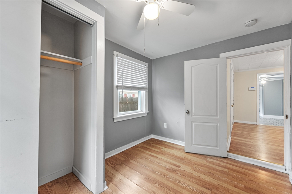 25 Durham Street Lawrence, MA 01843 - Photo 9 of 34 a view of empty room with wooden floor and fan