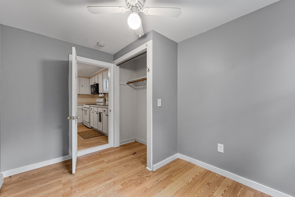 25 Durham Street Lawrence, MA 01843 - Photo 10 of 34 a view of a hallway with wooden floor