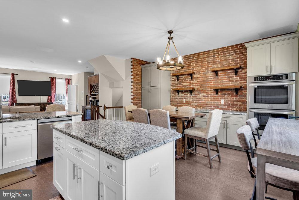 305 Spirit Way Brick, NJ 08723 - Photo 15 of 29 a kitchen with sink cabinets and dining table