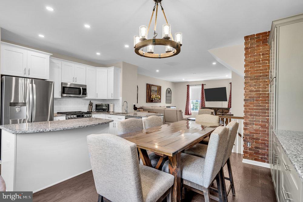 305 Spirit Way Brick, NJ 08723 - Photo 18 of 29 a view of kitchen with sink dining table and chairs