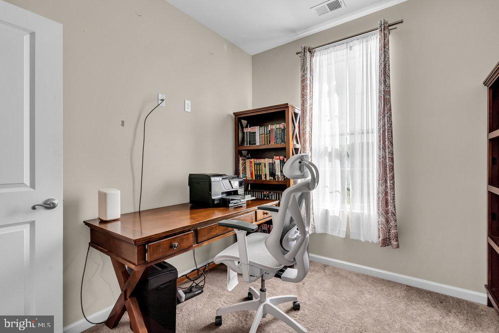 305 Spirit Way Brick, NJ 08723 - Photo 25 of 29 a view of a workspace with furniture and a window