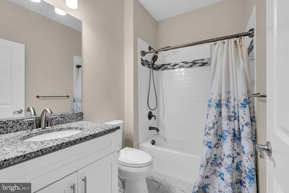 305 Spirit Way Brick, NJ 08723 - Photo 26 of 29 a bathroom with a granite countertop sink toilet and shower