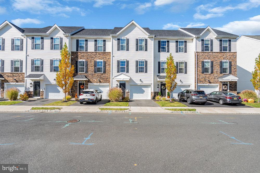 305 Spirit Way Brick, NJ 08723 - Photo 29 of 29 a view of multiple houses with a street