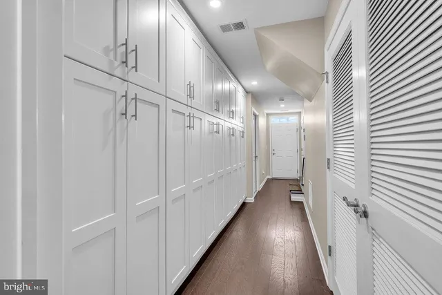 a view of hallway with wooden floor