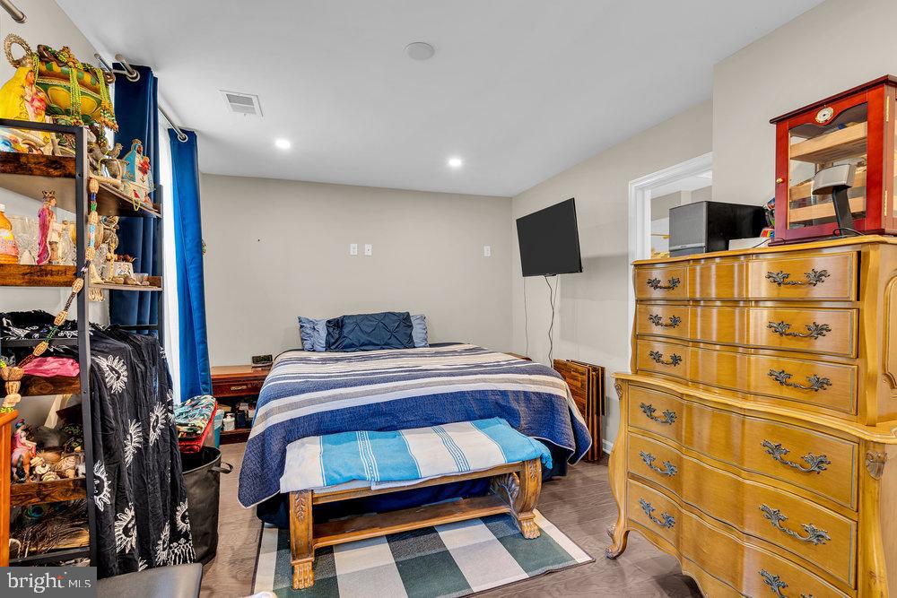 305 Spirit Way Brick, NJ 08723 - Photo 5 of 29 a bedroom with a bed and a flat tv screen