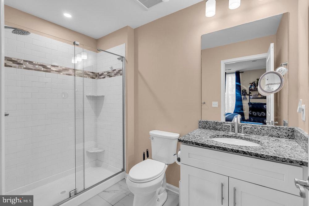 305 Spirit Way Brick, NJ 08723 - Photo 7 of 29 a bathroom with a granite countertop sink mirror vanity and toilet