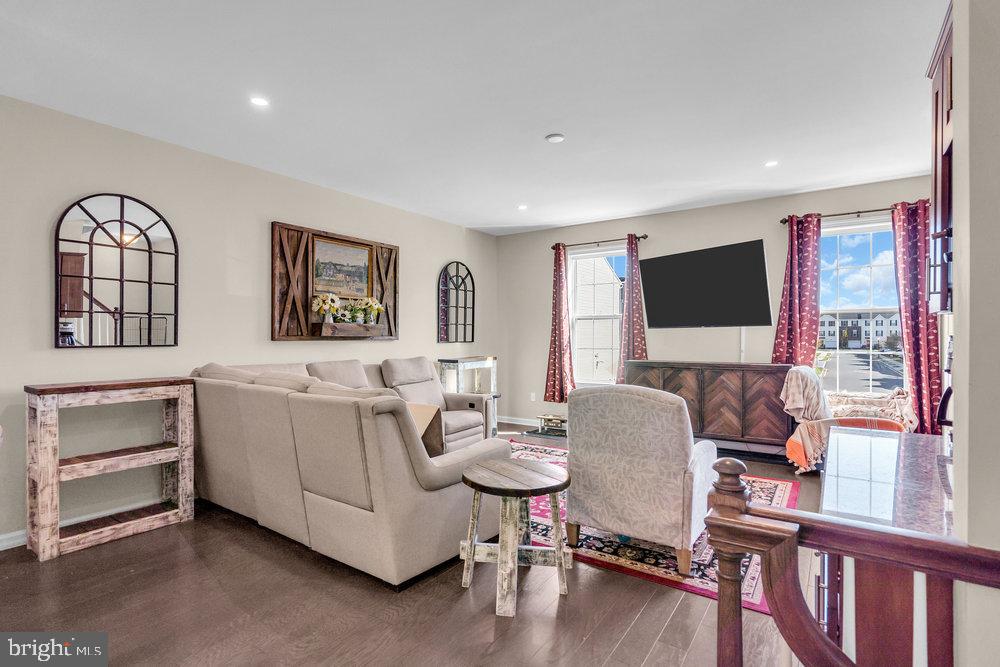 305 Spirit Way Brick, NJ 08723 - Photo 8 of 29 a living room with furniture a flat screen tv and a window