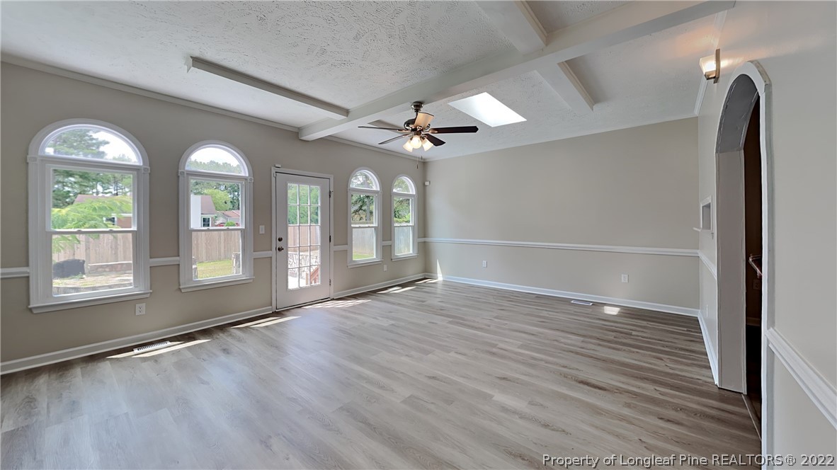 1153 Hoke Loop Road Fayetteville, NC 28314 - Photo 17 of 20 wooden floor in an empty room with a window