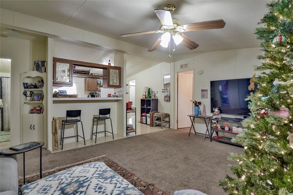 214 Gandy Street Lipan, TX 76462 - Photo 11 of 40 a view of a livingroom with furniture and a kitchen