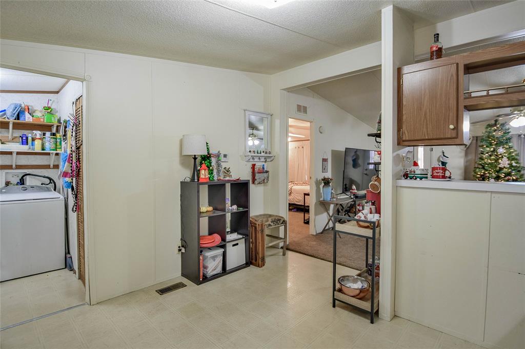 214 Gandy Street Lipan, TX 76462 - Photo 18 of 40 a room with storage and utility