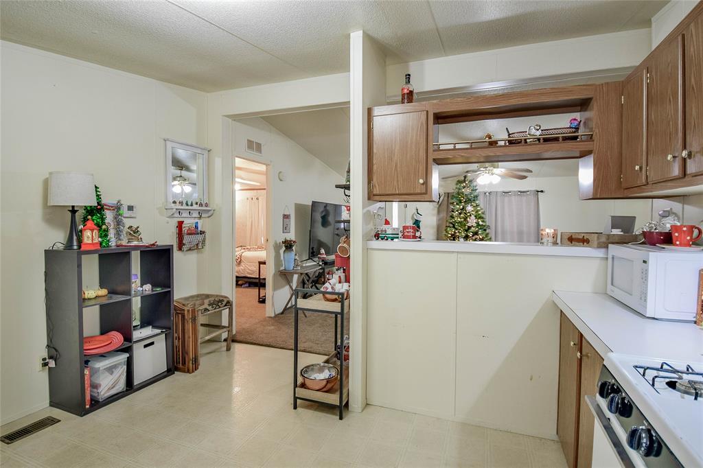 214 Gandy Street Lipan, TX 76462 - Photo 19 of 40 a room with storage and utility