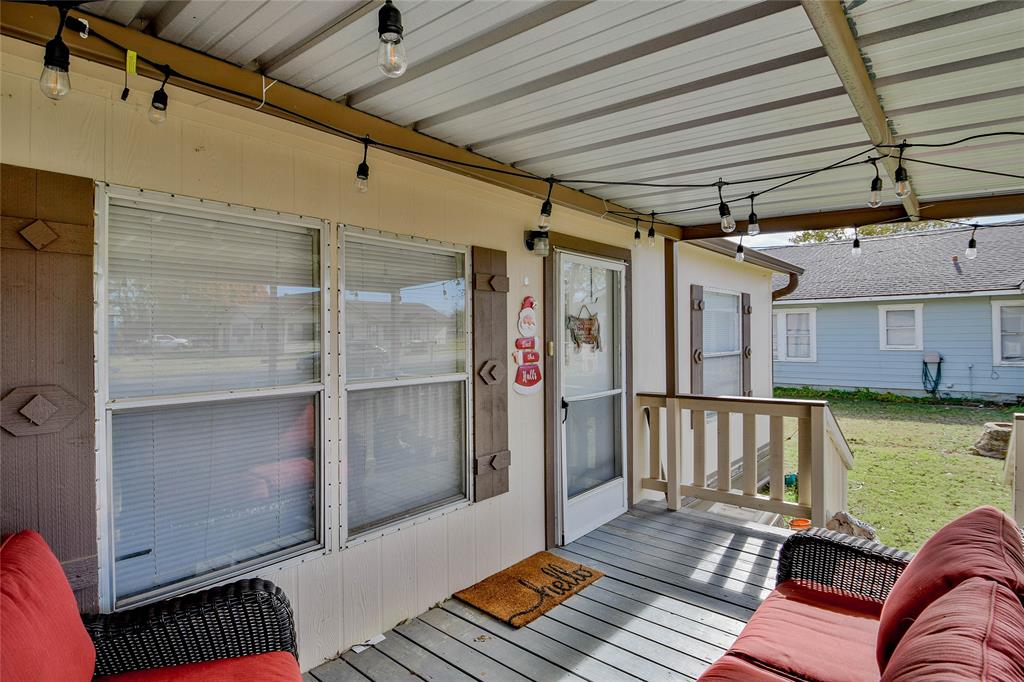 214 Gandy Street Lipan, TX 76462 - Photo 2 of 40 a balcony with furniture