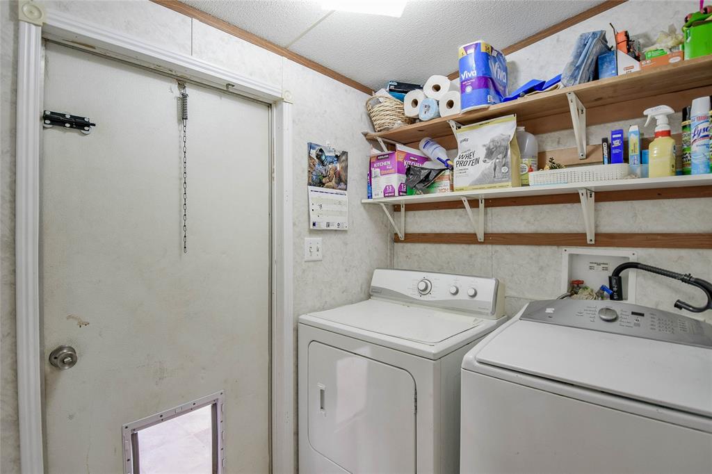 214 Gandy Street Lipan, TX 76462 - Photo 21 of 40 a utility room with dryer and washer