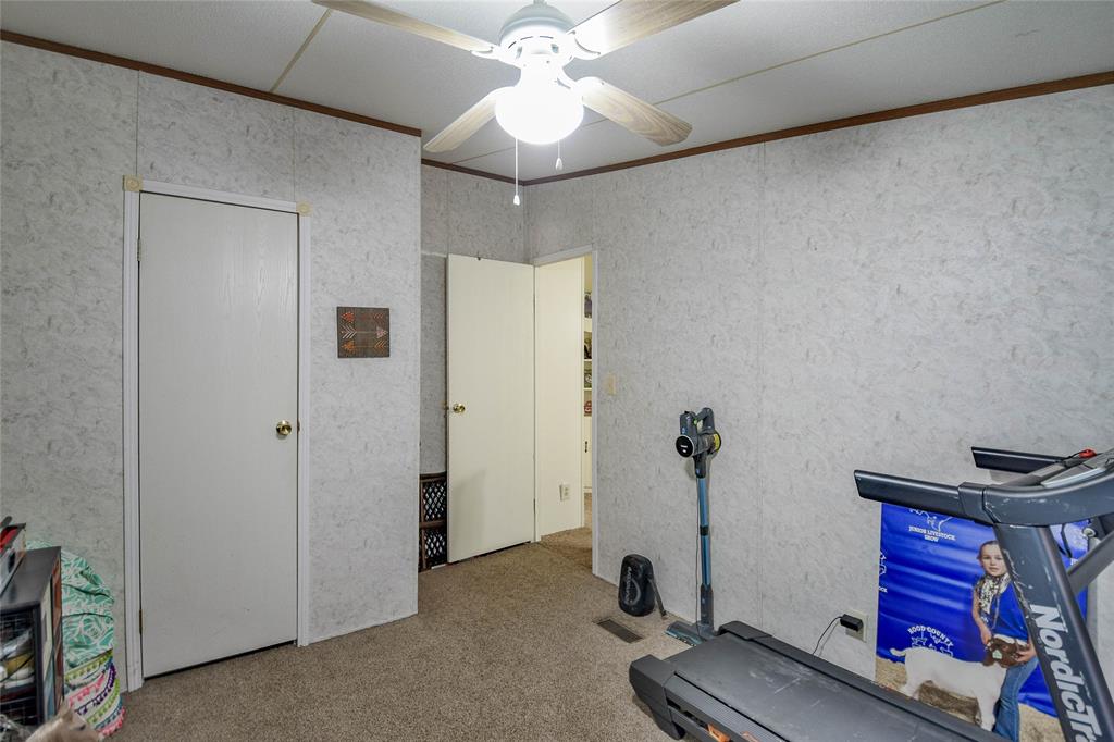 214 Gandy Street Lipan, TX 76462 - Photo 31 of 40 a view of a room with gym equipment
