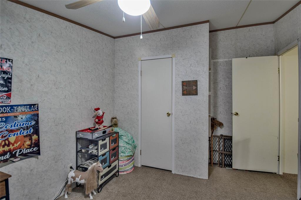 214 Gandy Street Lipan, TX 76462 - Photo 32 of 40 a view of a storage & utility room with two washing machine