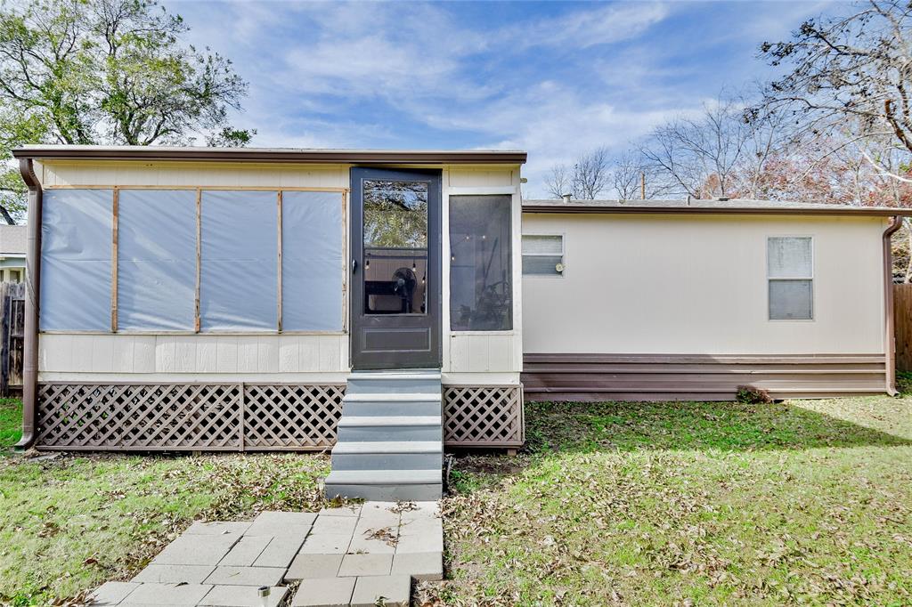 214 Gandy Street Lipan, TX 76462 - Photo 36 of 40 a front view of a house with a yard